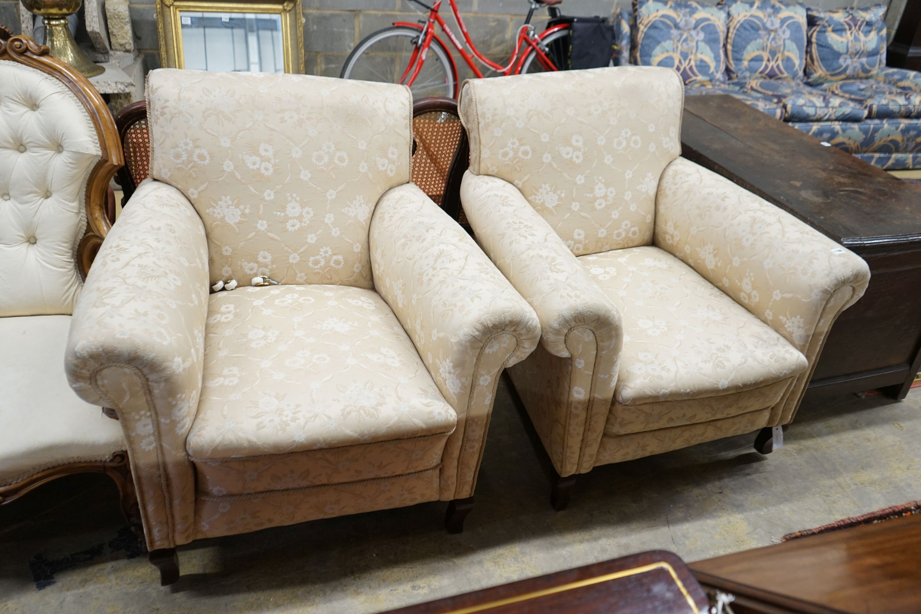 A pair of late Victorian upholstered armchairs, width 90cm, depth 84cm, height 94cm